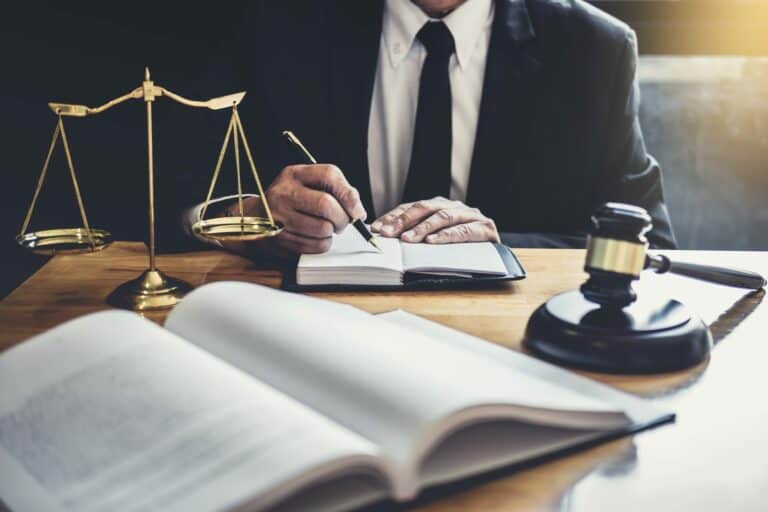 Male lawyer or judge working with contract papers
